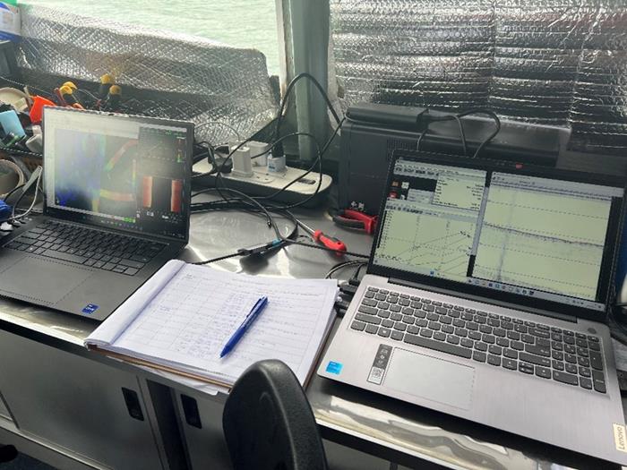 Work desk setup on the boat. Bathymetry and sub-bottom profiling data are recorded and displayed in these workstation laptops. (Source: Abang Nugraha/Earth Observatory of Singapore)