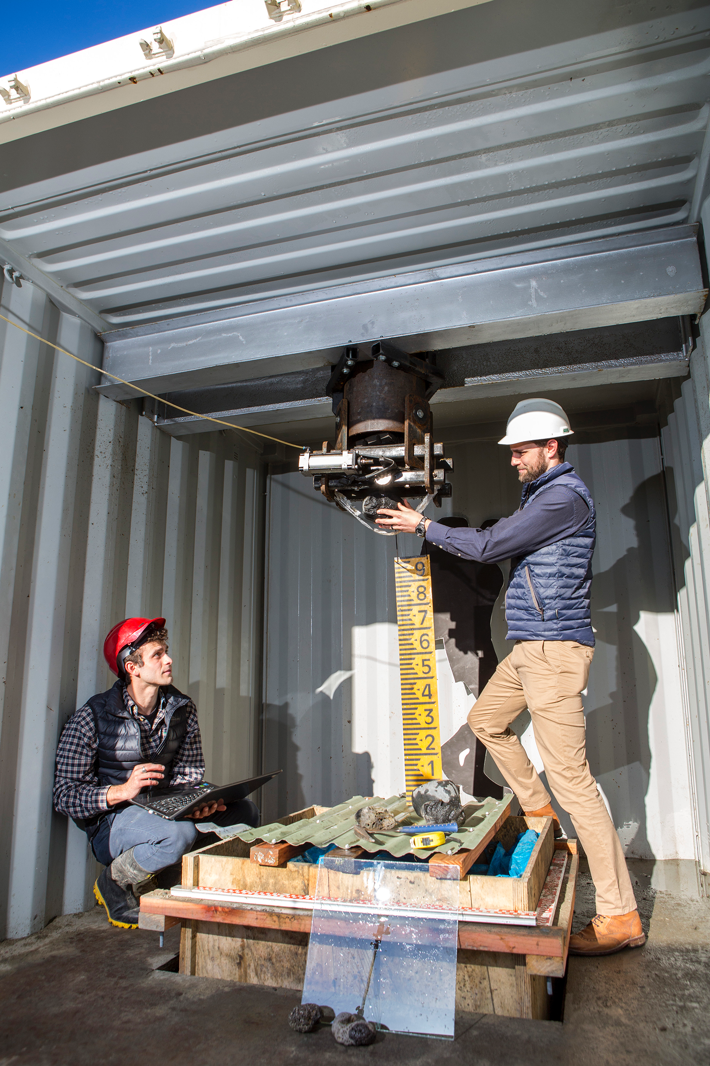 George Williams and co-author Thomas Wilson loading a volcanic block into the vertical cannon (Source: Craig Patton/University of Canterbury)