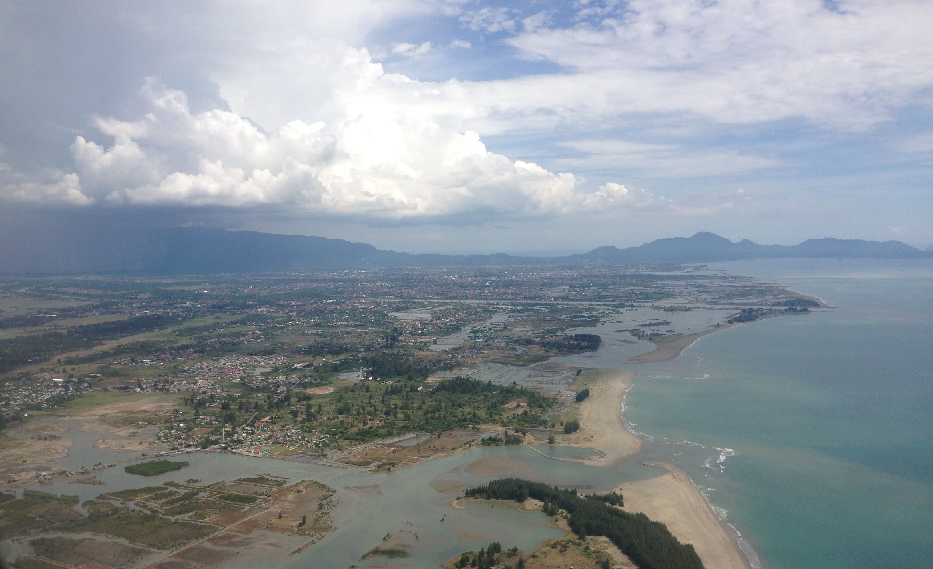 Banda Aceh and the surrounding areas after reconstruction. The 2004 tsunami reached ~3 kilometres inland across the low-lying terrain. After this, the international reconstruction effort rebuilt mostly in-place in areas near the coast (Source: Jamie McCaughey/EOS)