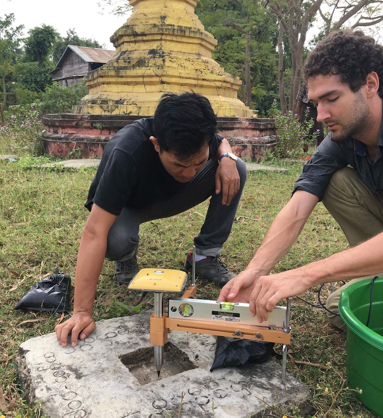 Asst. Prof Lindsey (left) and Dr Lin Thu Aung surveying a GPS benchmark in 2017 to understand plate movements in Southeast Asia (Source: Eric Lindsey/Earth Observatory of Singapore)