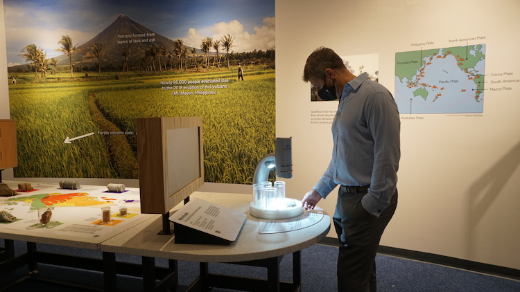 Professor Horton interacting with an exhibit from 'Earth Alive' (Source: Rachel Siao/Earth Observatory of Singapore)