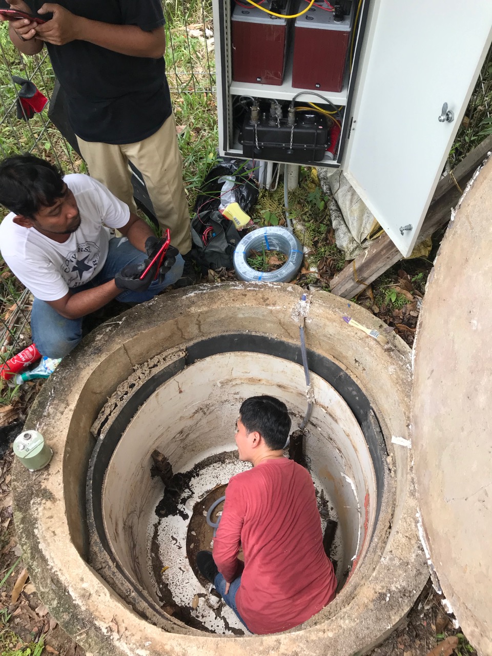 A CGO field engineer and local technicians servicing a seismic station near Mount Marapi in Sumatra, Indonesia (Source: Leong Choong Yew/Earth Observatory of Singapore)