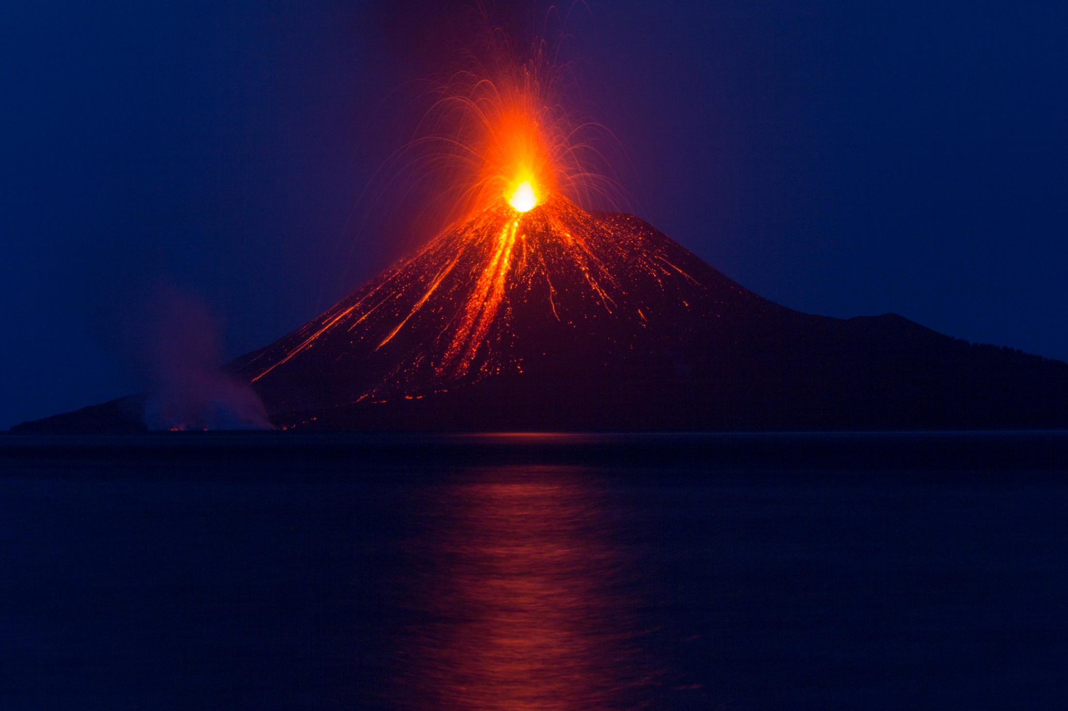 Figure 1: Anak Krakatau at the start of one of its eruptions in August 2018. Slope failure occurred on the southwestern flank, which is left in this image (Source: Dr James D. P. Moore/Earth Observatory of Singapore)