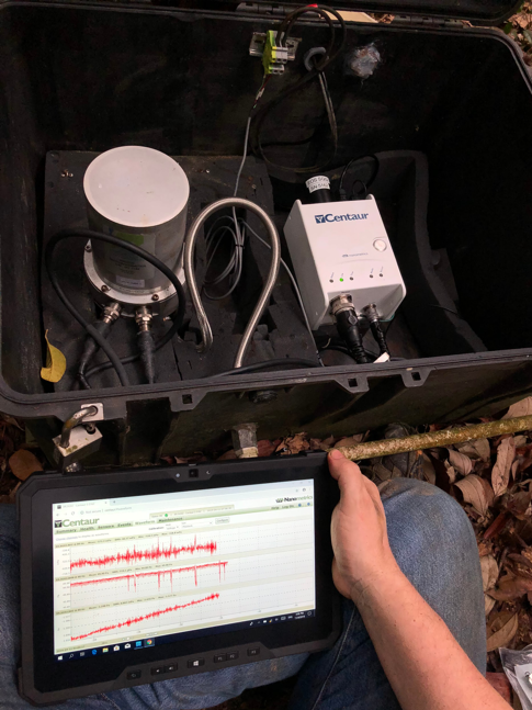EOS volcanologists in MacRitchie Reservoir installing one of the five infrasound instruments in Singapore (Source: Earth Observatory of Singapore/Anna Perttu)