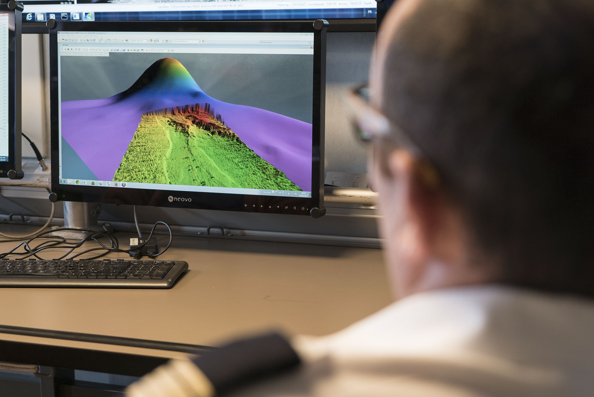 Captain Florent Landreau observes as higher resolution bathymetry fills in the blanks of previous elevation models in this area (Source: EOS/Monika Naranjo Gonzales)