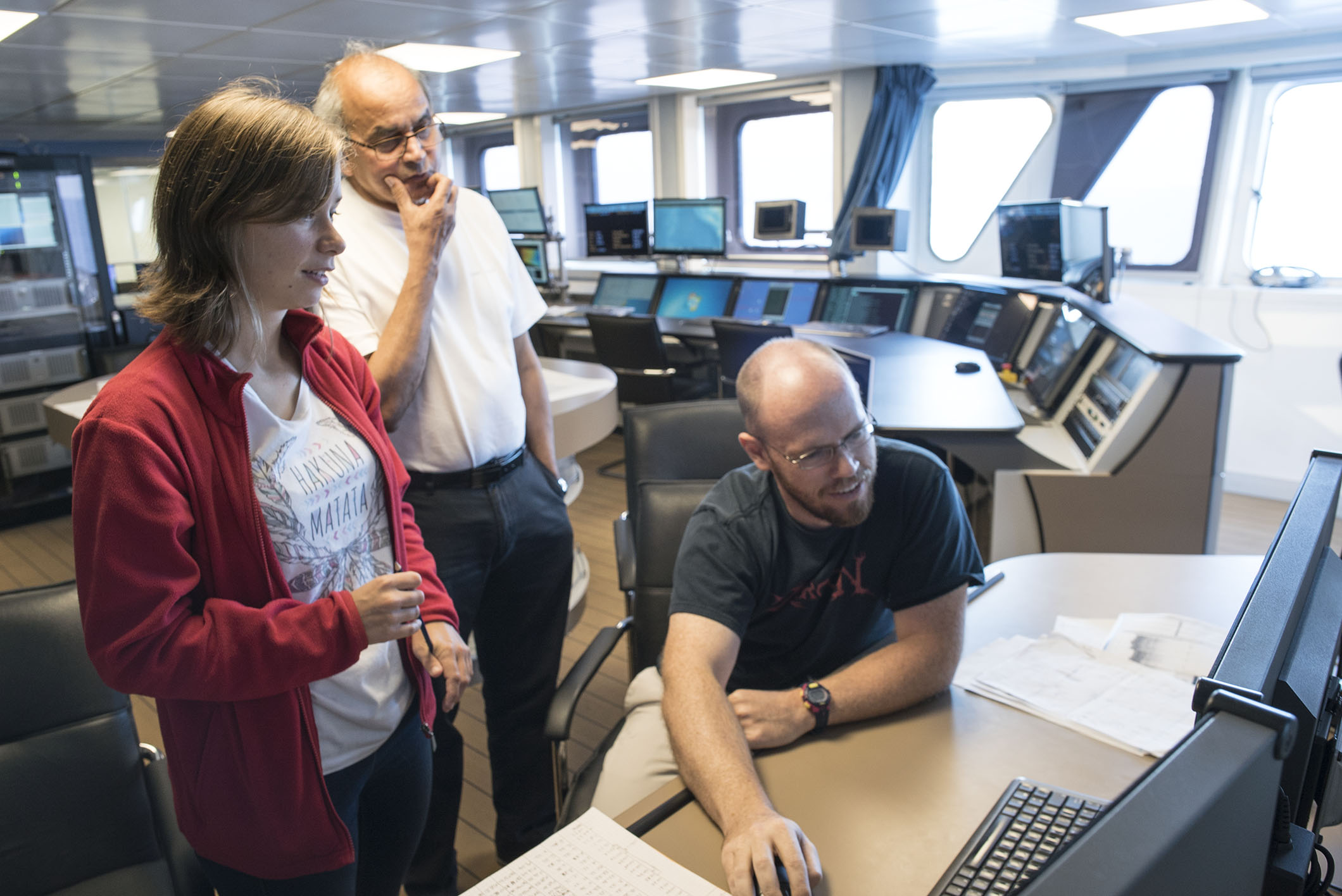 Marie-Laure Fournasson, Chief Scientists Satish Singh and Dr Kyle Bradley discuss possible stories to explain the geological features found during the survey (Source: EOS/Monika Naranjo Gonzales)