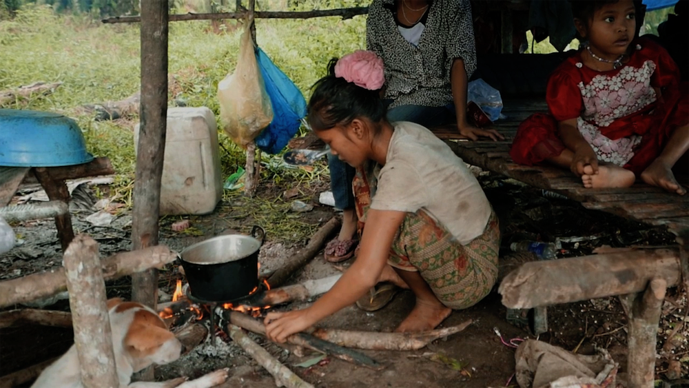 A woman prepares a meal of mushrooms in one of the cooking corners in the Orang Rimba camp that we visited (Source: Isaac Kerlow) A woman prepares a meal of mushrooms in one of the cooking corners in the Orang Rimba camp that we visited (Source: Isaac Kerlow)
