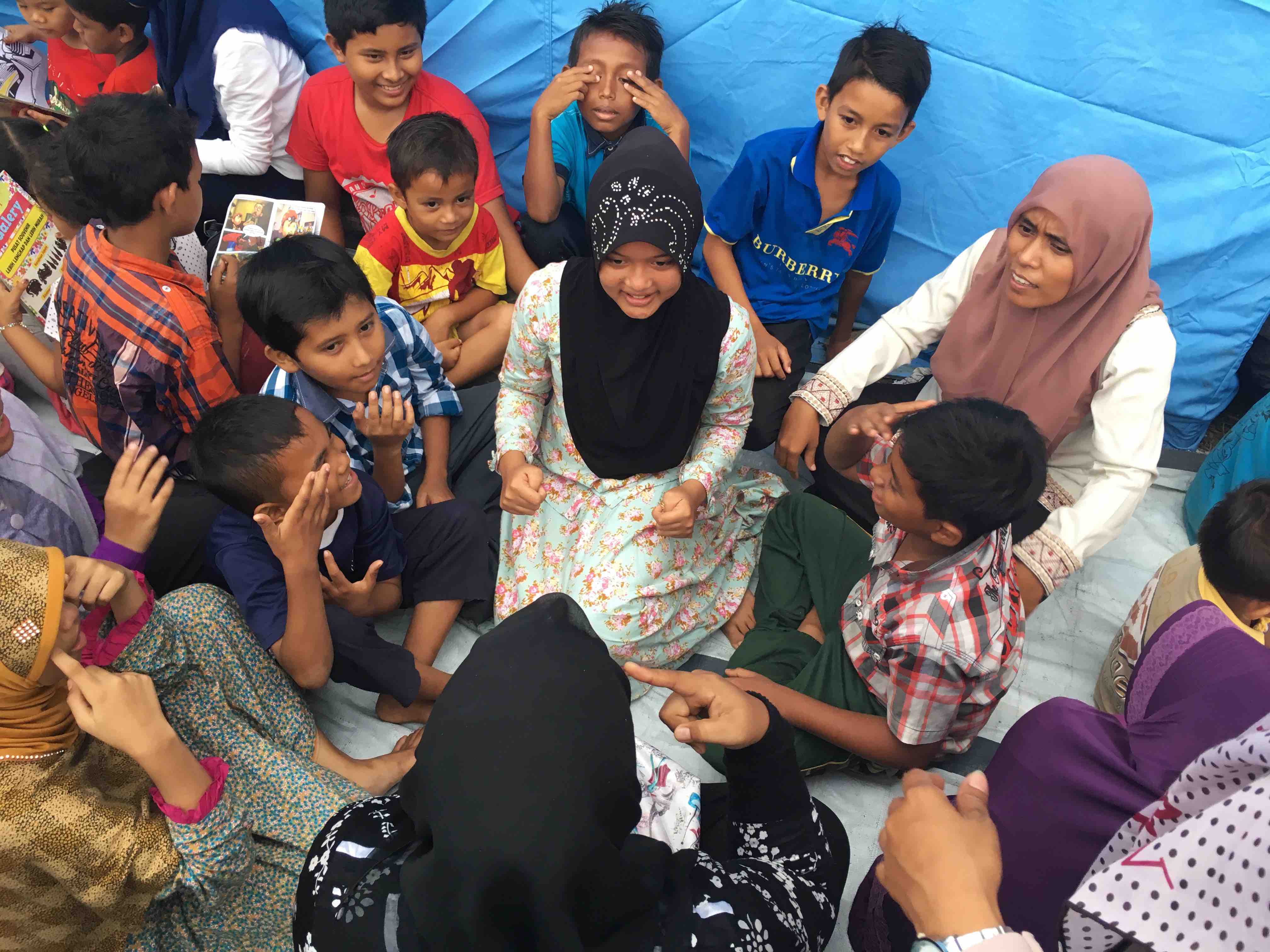 Providing psychosocial services for children. Restoring a sense of normal activities is an important way to support children coping with the disaster. (Source: ICAIOS) Providing psychosocial services for children. Restoring a sense of normal activities is an important way to support children coping with the disaster. (Source: ICAIOS)