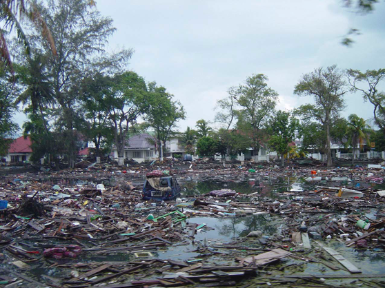 Trash and debris line the streets near local homes in downtown Banda Aceh, Sumatra, after a powerful tsunami swept through the area on 26 Dec 2004 (Source: US Navy/Wikimedia Commons) Trash and debris line the streets near local homes in downtown Banda Aceh, Sumatra, after a powerful tsunami swept through the area on 26 Dec 2004 (Source: US Navy/Wikimedia Commons)
