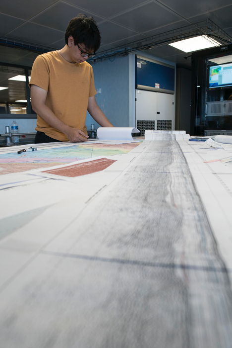 Harry Telajan Linang, a student participating in the Floating Summer School programme, reviews seismic data in the Science Control Room (Source: EOS/Monika Naranjo Gonzales)