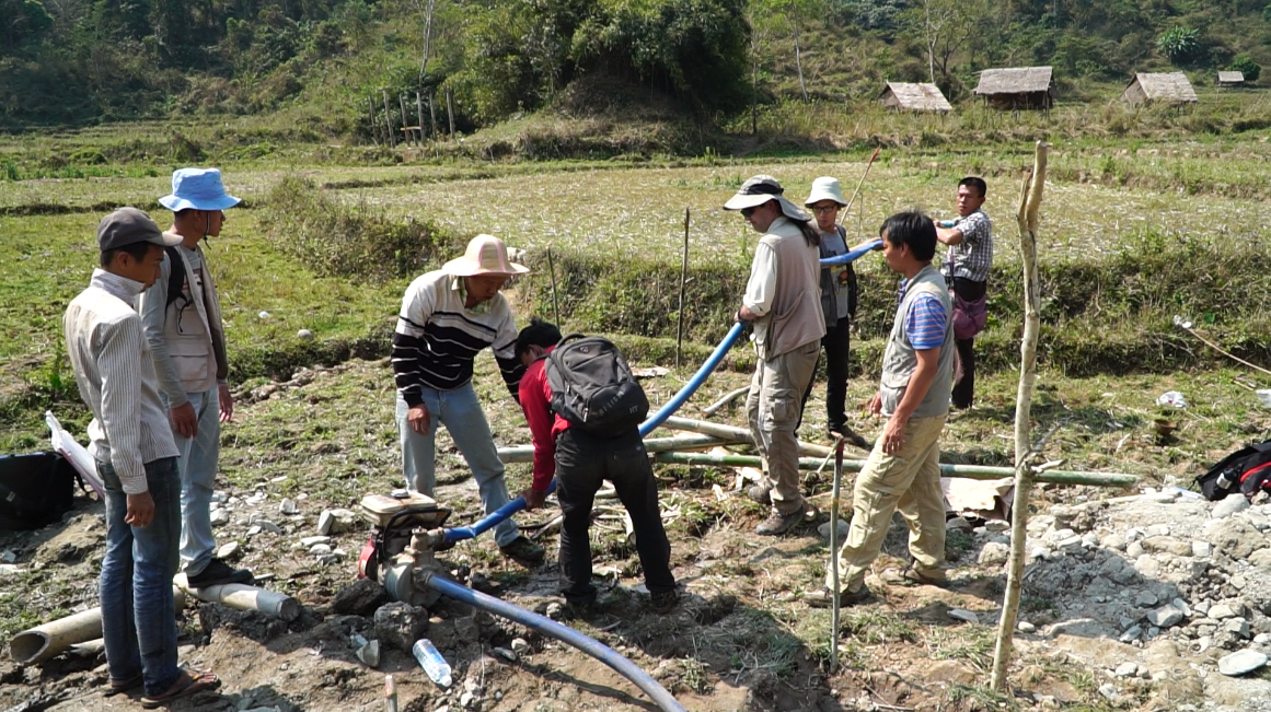 The team pumps groundwater out of the trench in order to continue working (Source: Yvonne Soon)