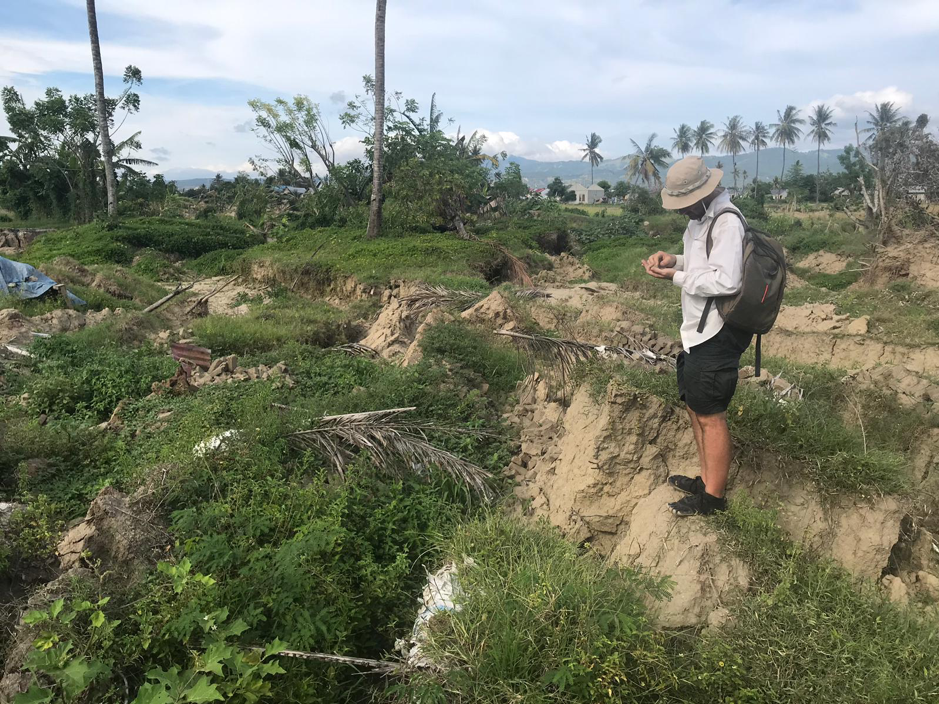EOS Research Fellow Jedrzej Majewski at the head scarp of a slide in the Petobo sub-district in Palu (Source: Adam Switzer/ Earth Observatory of Singapore)