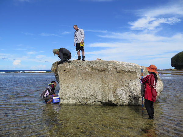 Assoc Prof Switzer’s research team measures reef boulders transported during Typhoon Haiyan on a wave-cut terrace in Hernani, Samar (Source: Lea Soria)