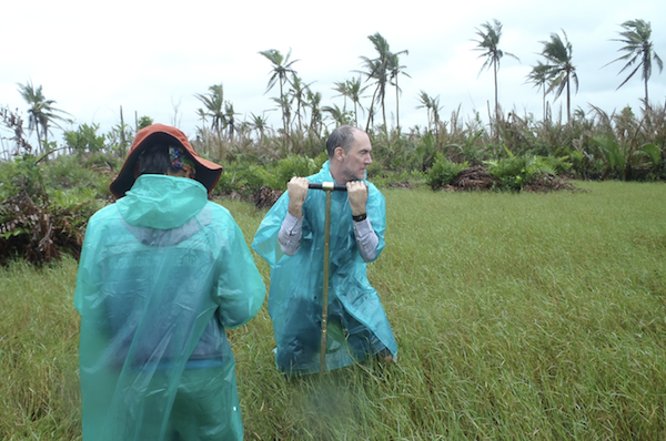 Assoc Prof Switzer and his team take core samples to map the thickness and extent of sand deposited inland by a storm surge in Tanauan, Leyte (Source: Angel Doctor)