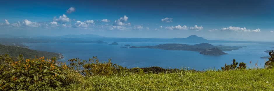 A picturesque view of a peaceful Taal volcano. Volcano Island can be seen sitting on Lake Taal in the volcano’s caldera (Source: Ray in Manila/flickr)