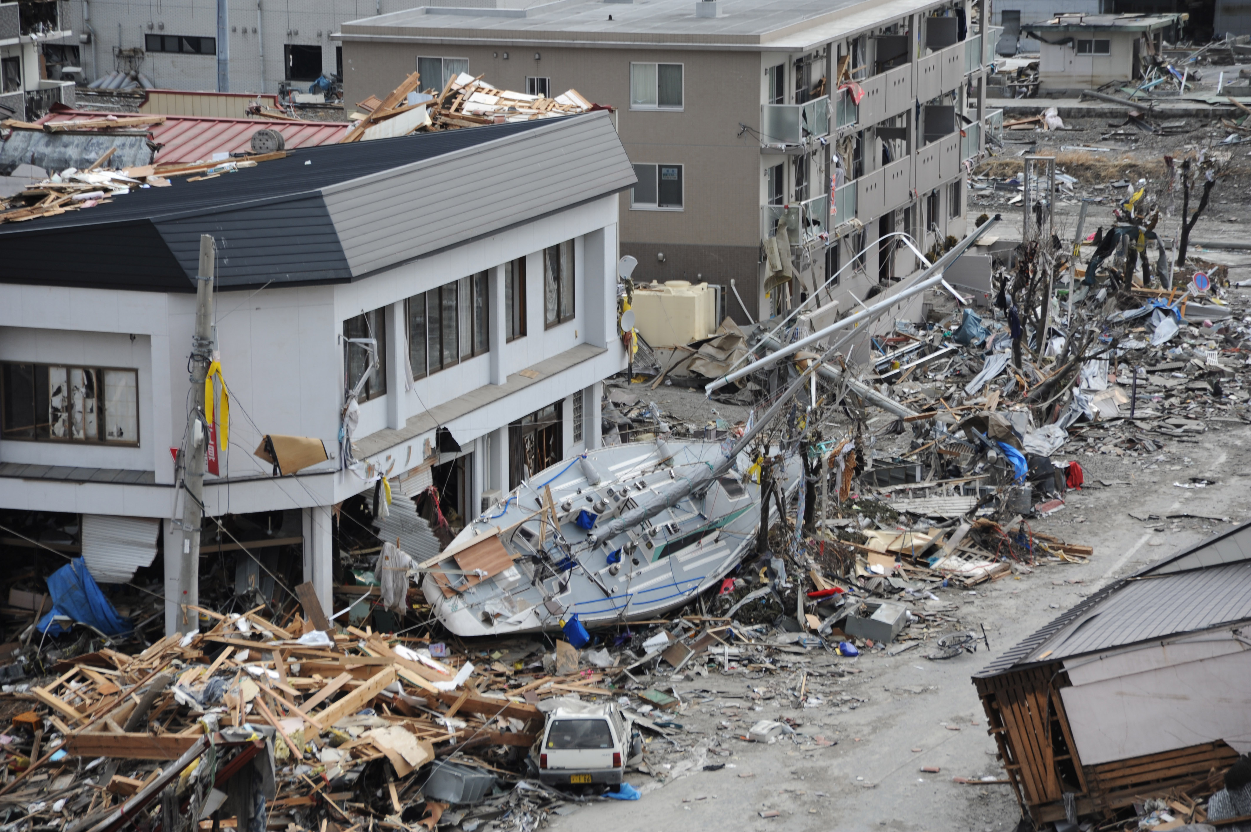 A fishing boat among the debris in Ofunato, Japan, following the 9.0-magnitude earthquake and subsequent tsunami (Source: Matthew M. Bradley/Wikimedia Commons)