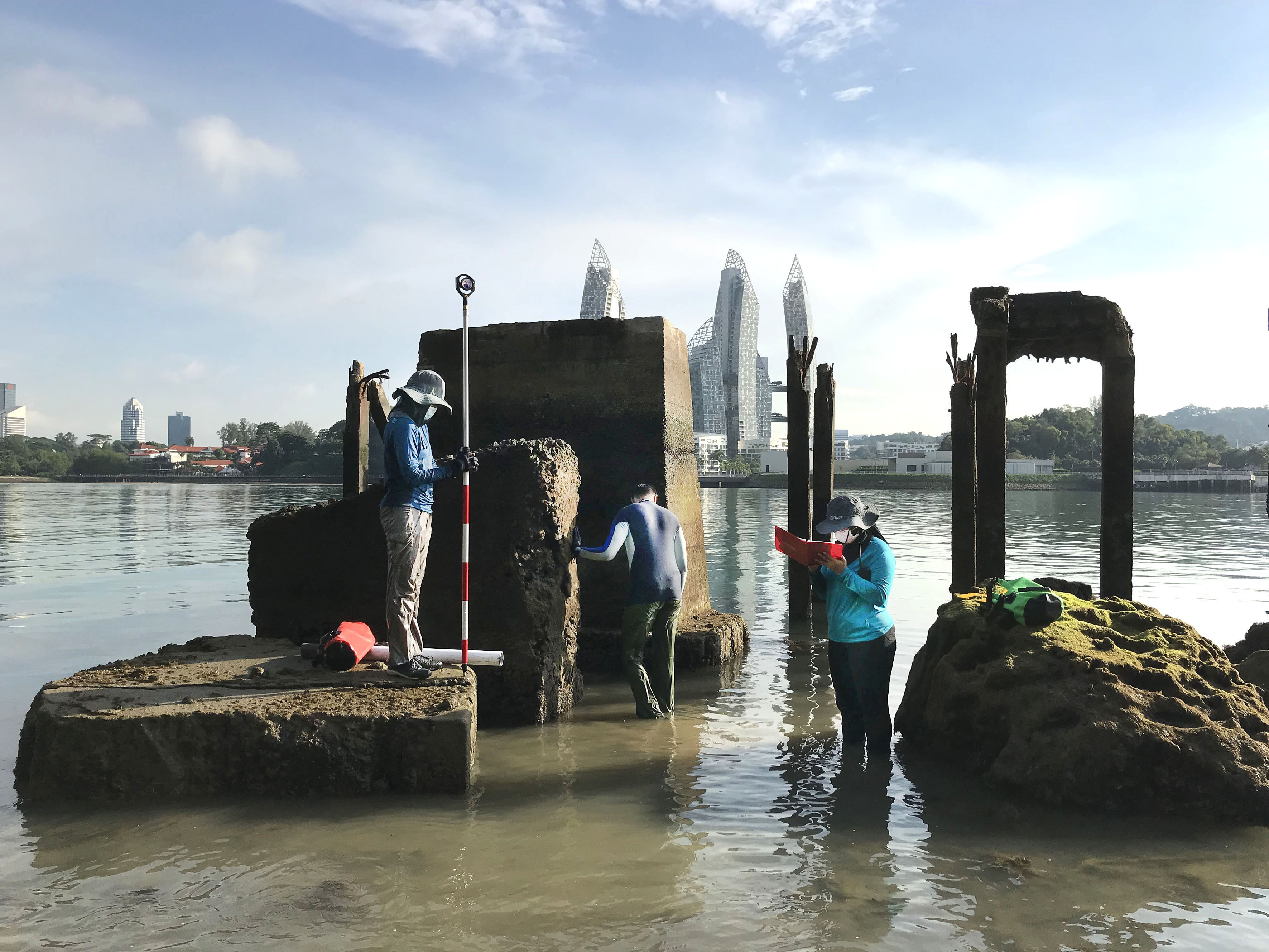 EOS researchers conducting fieldwork on corals, which record sea-level changes, in Sentosa, Singapore (Source: Aron Meltzner)